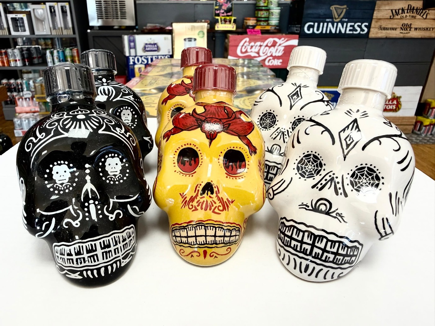 Hand-painted Day of the Dead skull tequila bottles
